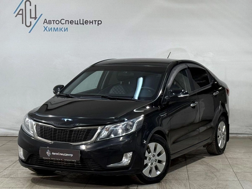 Автомобиль Kia Rio III поколение 1.6 6MT (123 л.с.) Prestige Чёрный 2014 с пробегом 180 000 км