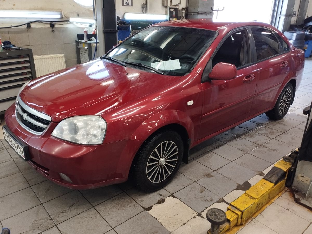 Автомобиль Chevrolet Lacetti I поколение 1.4 MT (95 л.с.) Plus Красный 2011 с пробегом 149 485 км