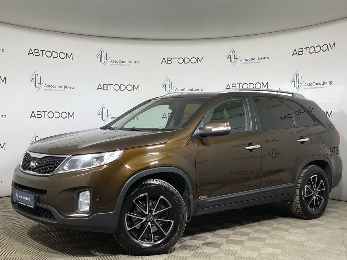 Автомобиль Kia Sorento II [рестайлинг] 2.4 AT 4WD (175 л.с.) New Comfort (2015) Коричневый 2014 с пробегом 173 217 км