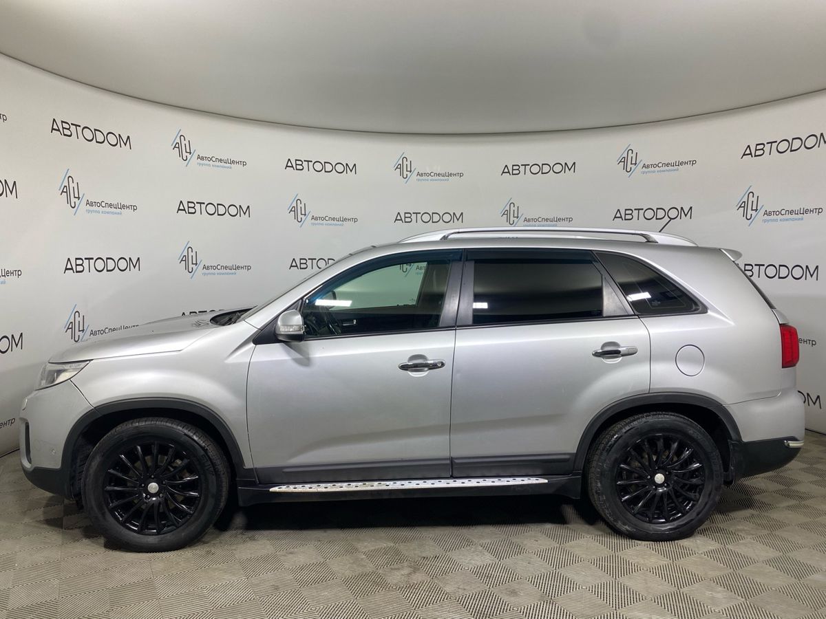 Kia Sorento II [рестайлинг] 2.4 AT 4WD (175 л.с.) New Luxe (2015) Серебристый 2012 с пробегом 181 113 км