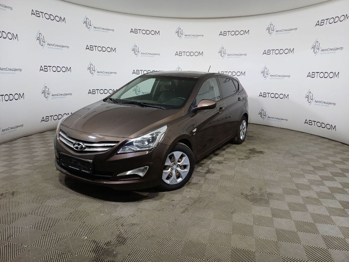 Hyundai Solaris I [рестайлинг] 1.6 AT (123 л.с.) Base Оранжевый 2015 с пробегом 120 000 км
