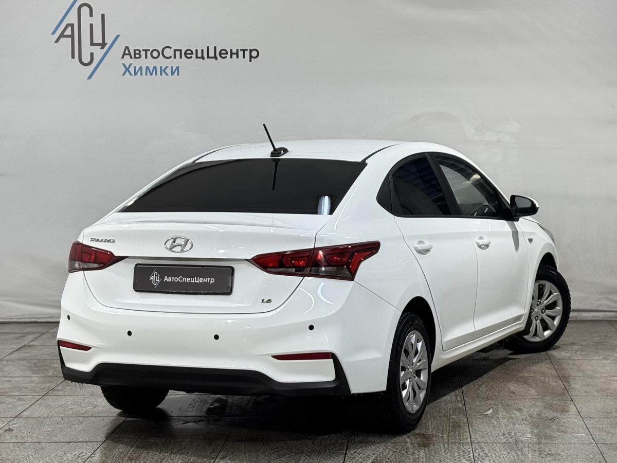 Автомобиль Hyundai Solaris II поколение 1.6 AT (123 л.с.) Comfort Белый 2019 с пробегом 94 000 км