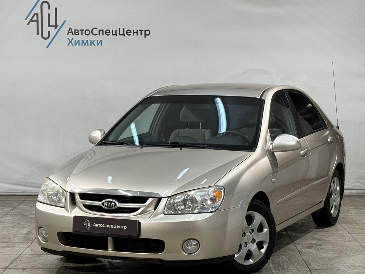 Автомобиль Kia Cerato I поколение 1.6 AT (105 л.с.) Base Золотой 2006 с пробегом 167 000 км