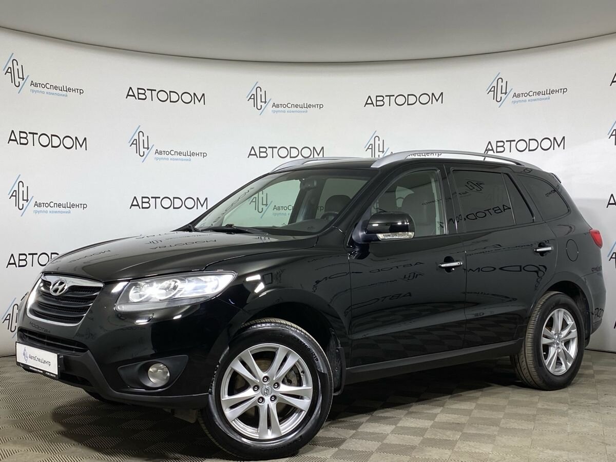 Автомобиль Hyundai Santa Fe II (CM) [рестайлинг] 2.4 AT 4WD (174 л.с.) Elegance + Navi Чёрный 2011 с пробегом 243 000 км