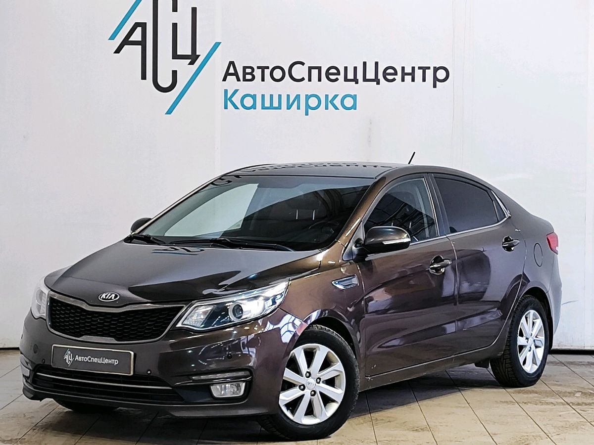 Автомобиль Kia Rio III [рестайлинг] 1.6 AT (123 л.с.) Prestige Коричневый 2015 с пробегом 156 048 км
