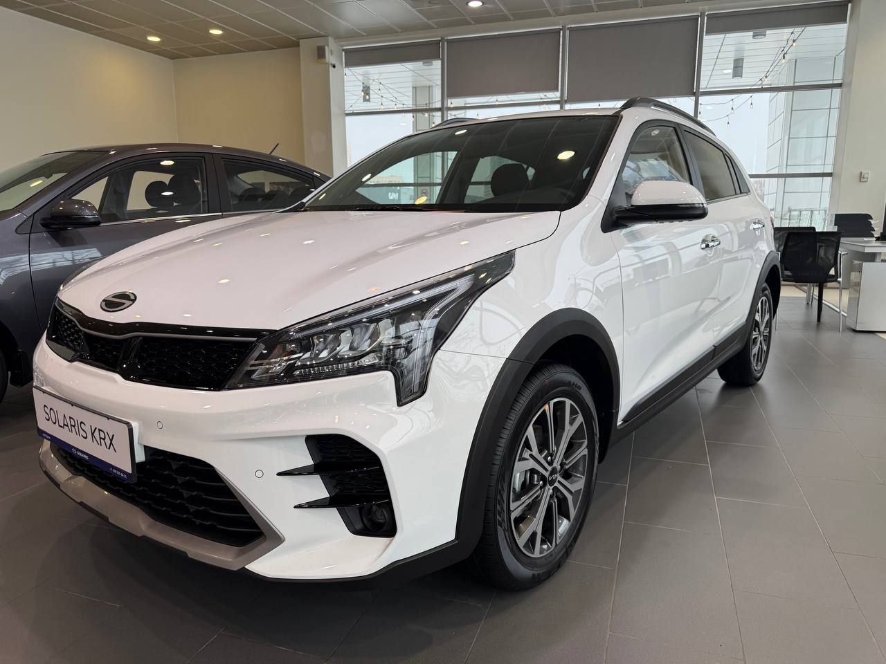 Автомобиль Solaris KRX I поколение 1.6 AT (123 л.с.) Prestige Белый 2025 новый