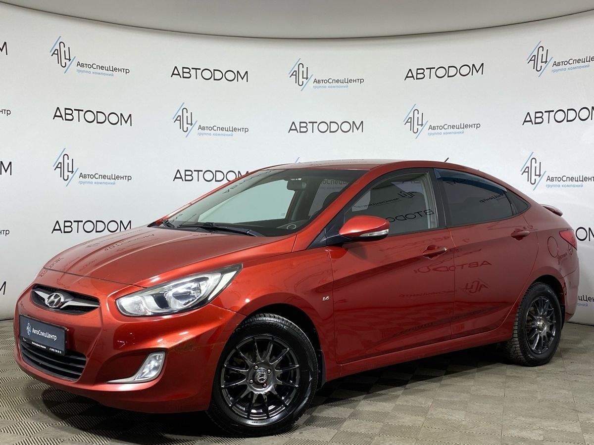 Автомобиль Hyundai Solaris I поколение 1.6 AT (123 л.с.) Classic Красный 2012 с пробегом 142 000 км