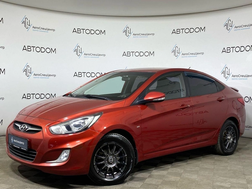 Автомобиль Hyundai Solaris I поколение 1.6 AT (123 л.с.) Classic Красный 2012 с пробегом 142 000 км