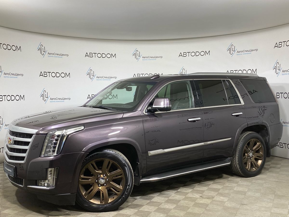 Cadillac Escalade IV поколение 6.2 AT 4WD (409 л.с.) Premium Коричневый 2015 с пробегом 214 304 км
