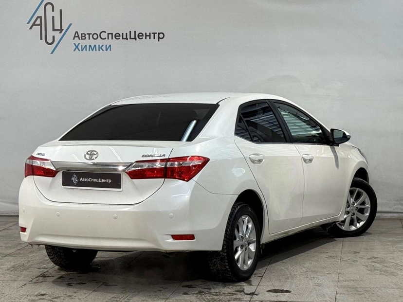 Автомобиль Toyota Corolla XI (E160/E170) 1.6 CVT (122 л.с.) Стиль Плюс Белый 2013 с пробегом 167 000 км