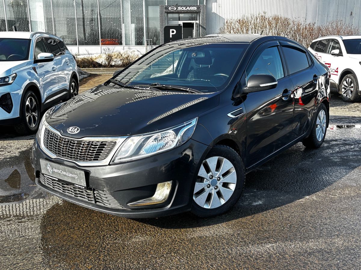 Автомобиль Kia Rio III поколение 1.6 4AT (123 л.с.) Prestige Чёрный 2014 с пробегом 390 000 км