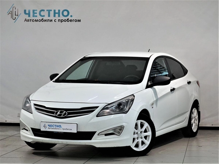 Автомобиль Hyundai Solaris I [рестайлинг] 1.6 AT (123 л.с.) Comfort Белый 2014 с пробегом 215 000 км