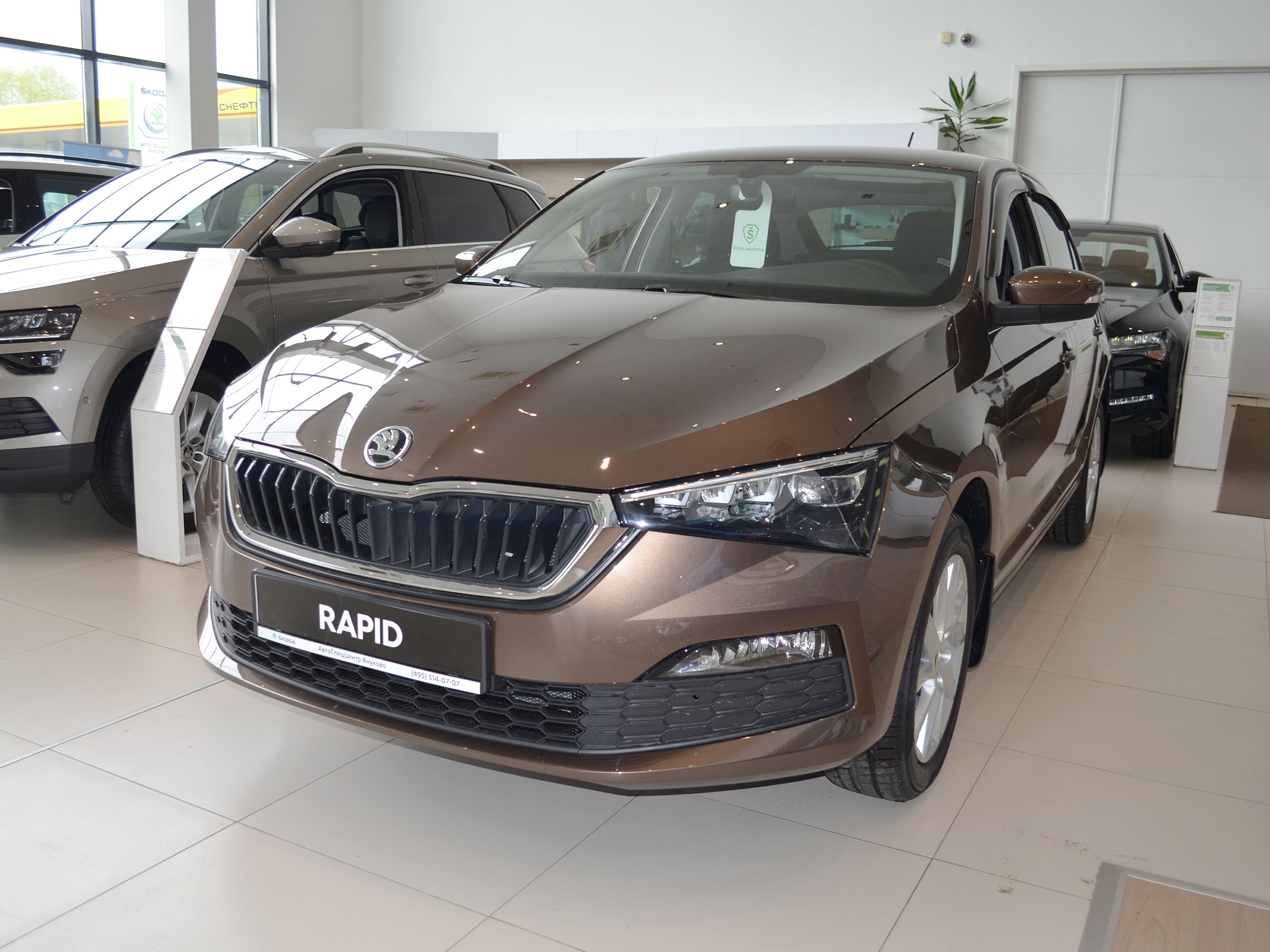 Автомобиль Skoda Rapid II поколение 1.4 AMT (125 л.с.) Ambition Коричневый 2022 новый