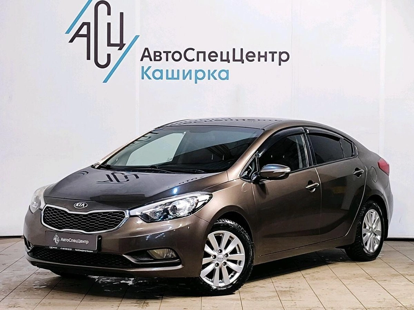 Автомобиль Kia Cerato III поколение 1.6 AT (130 л.с.) Luxe Коричневый 2015 с пробегом 216 100 км