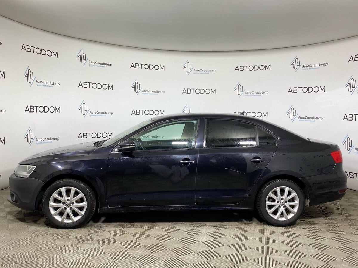 Автомобиль Volkswagen Jetta VI поколение 1.6 AT (105 л.с.) Style Чёрный 2013 с пробегом 206 326 км