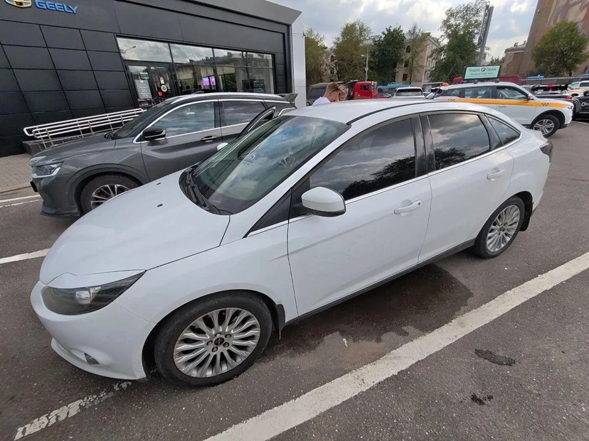 Ford Focus III поколение 2.0 AMT (150 л.с.) Titanium Белый 2014 с пробегом 197 645 км