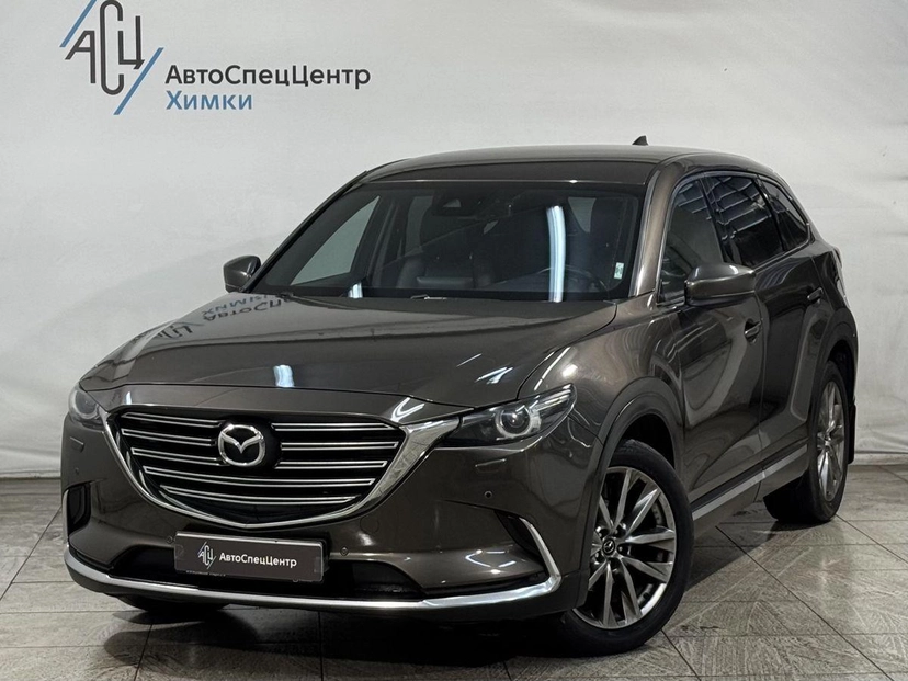 Автомобиль Mazda CX-9 II поколение 2.5 AT 4WD (231 л.с.) Supreme Коричневый 2018 с пробегом 114 000 км