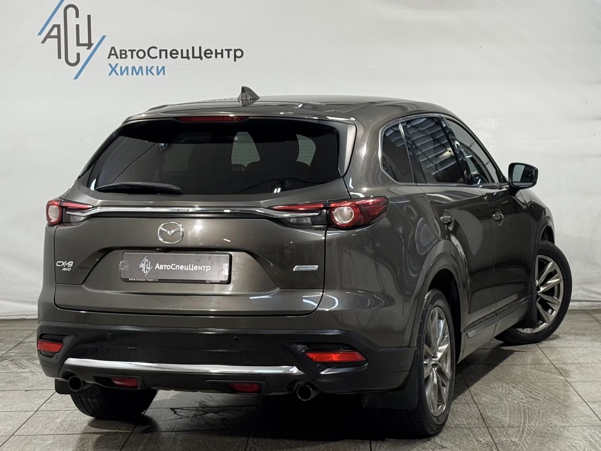 Автомобиль Mazda CX-9 II поколение 2.5 AT 4WD (231 л.с.) Supreme Коричневый 2018 с пробегом 114 000 км