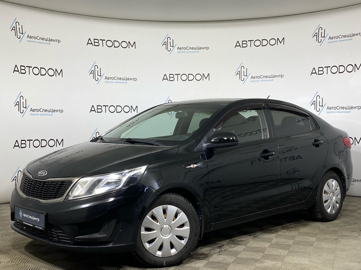 Автомобиль Kia Rio III поколение 1.4 AT (107 л.с.) Comfort Чёрный 2012 с пробегом 156 237 км