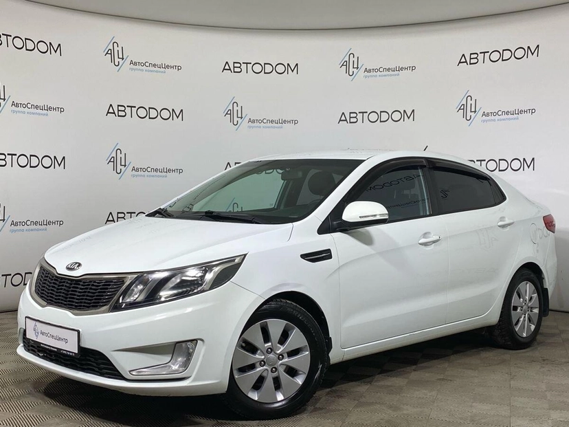 Автомобиль Kia Rio III поколение 1.6 4AT (123 л.с.) Prestige Белый 2013 с пробегом 155 491 км