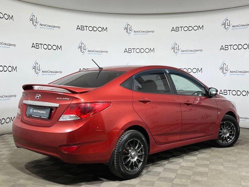 Автомобиль Hyundai Solaris I поколение 1.6 AT (123 л.с.) Classic Красный 2012 с пробегом 142 000 км
