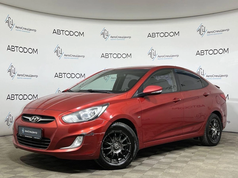 Автомобиль Hyundai Solaris I поколение 1.6 AT (123 л.с.) Classic Красный 2012 с пробегом 142 000 км