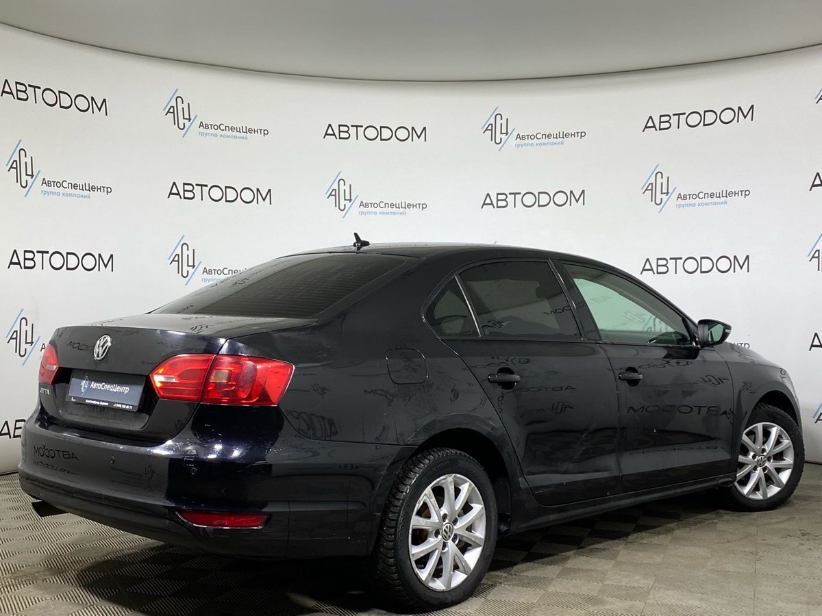 Автомобиль Volkswagen Jetta VI поколение 1.6 AT (105 л.с.) Style Чёрный 2013 с пробегом 206 326 км