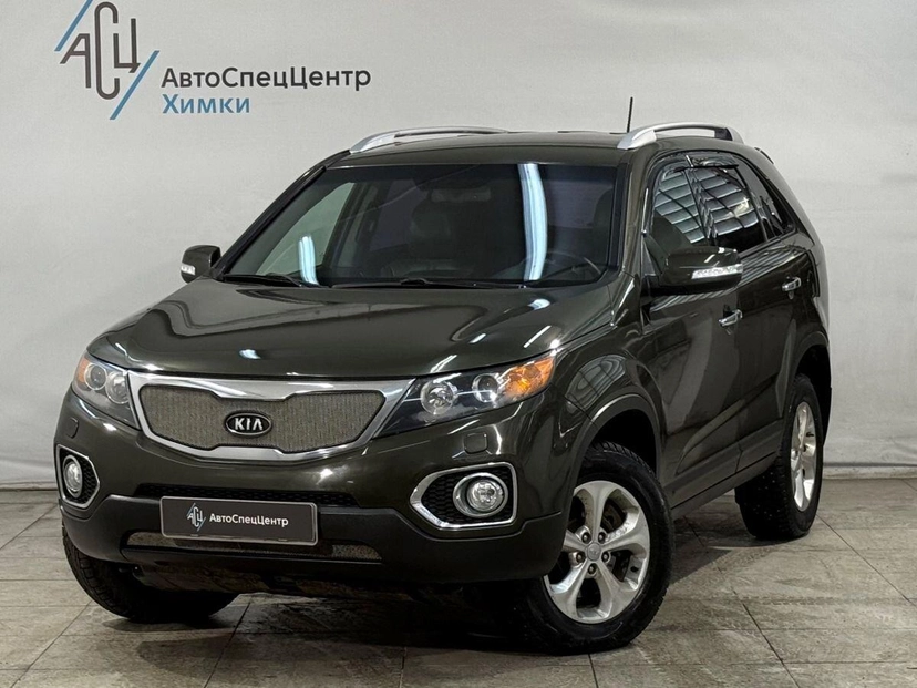 Автомобиль Kia Sorento II поколение 2.2d AT 4WD (197 л.с.) Prestige Зелёный 2010 с пробегом 275 000 км