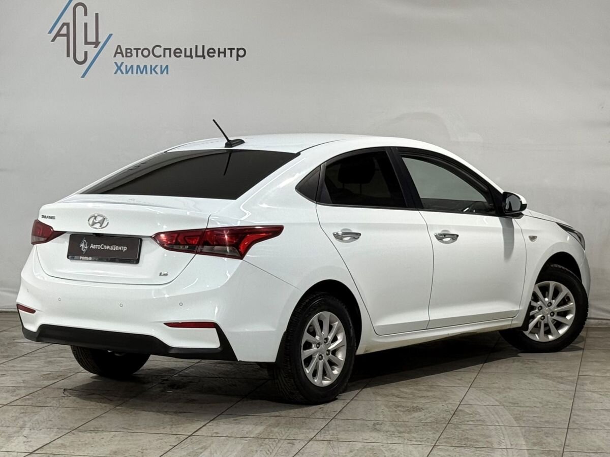 Автомобиль Hyundai Solaris II поколение 1.6 MT (123 л.с.) Elegance Белый 2017 с пробегом 148 422 км