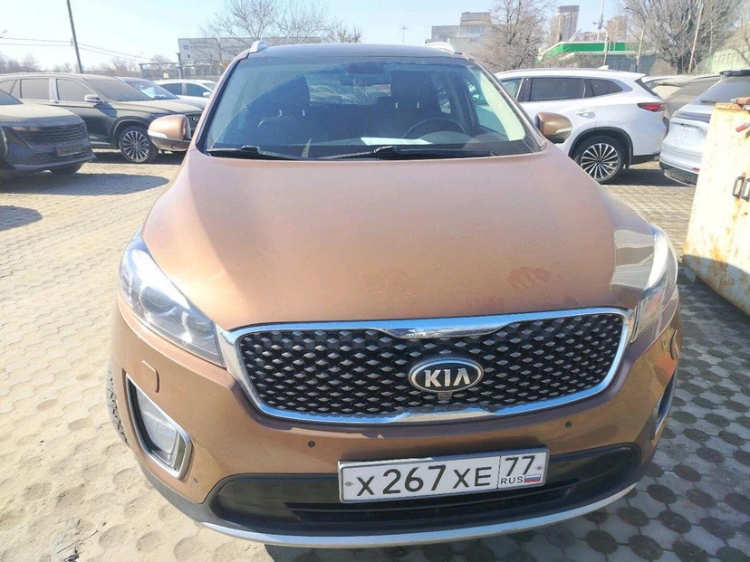 Автомобиль Kia Sorento III поколение 2.2d AT 4WD (5 мест) (200 л.с.) Premium Коричневый 2016 с пробегом 179 370 км