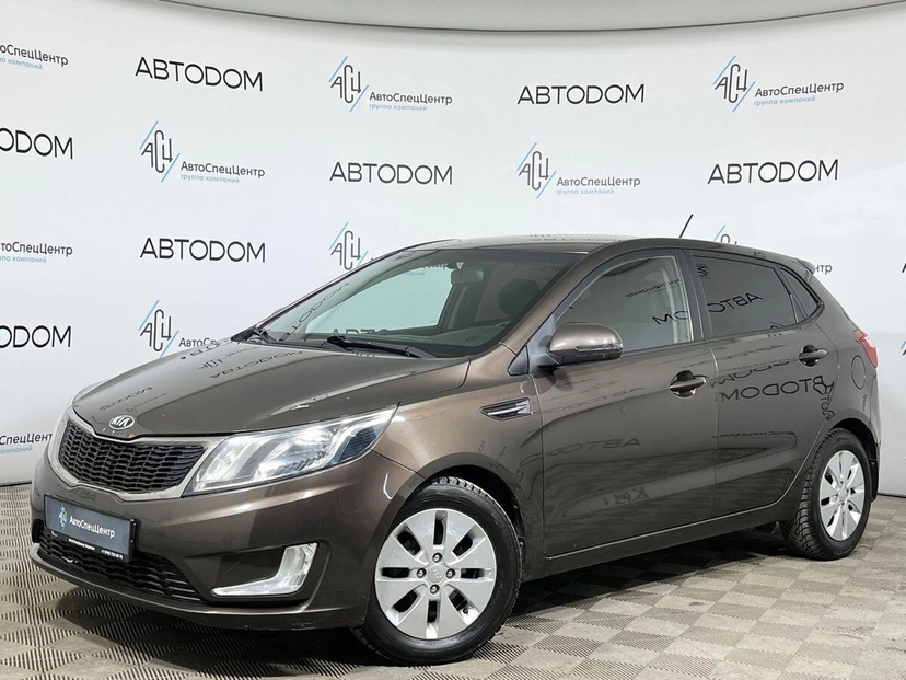 Автомобиль Kia Rio III поколение 1.6 6AT (123 л.с.) Prestige Коричневый 2014 с пробегом 81 304 км