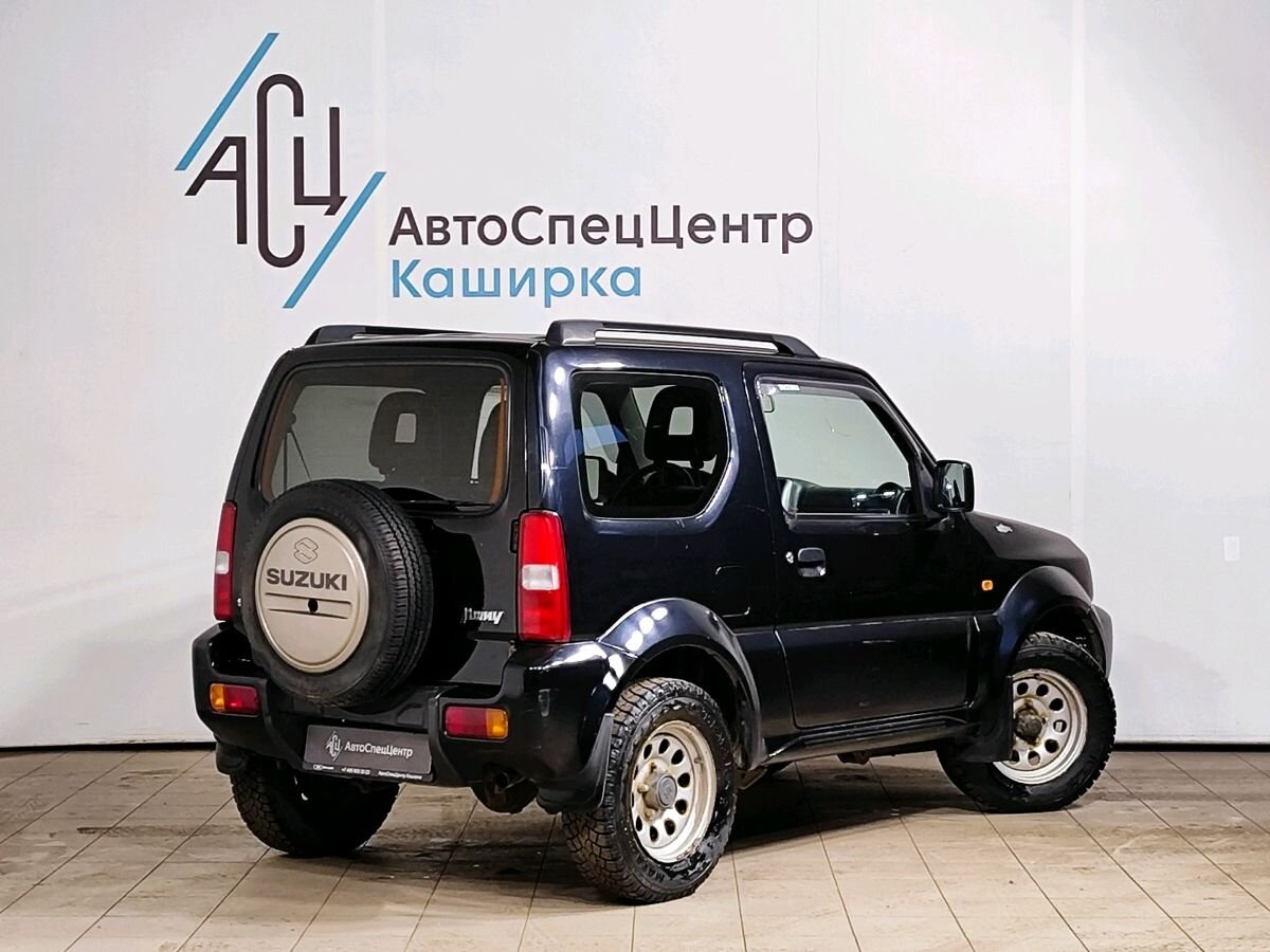 Автомобиль Suzuki Jimny III [1-й рестайлинг] 1.3 AT 4WD (85 л.с.) JLX Чёрный 2010 с пробегом 119 289 км