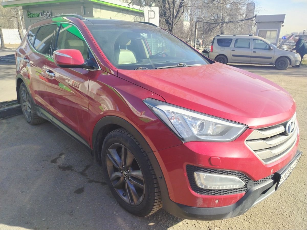 Автомобиль Hyundai Santa Fe III поколение (DM) 2.4 AT 4WD (175 л.с.) Dynamic Красный 2013 с пробегом 169 781 км