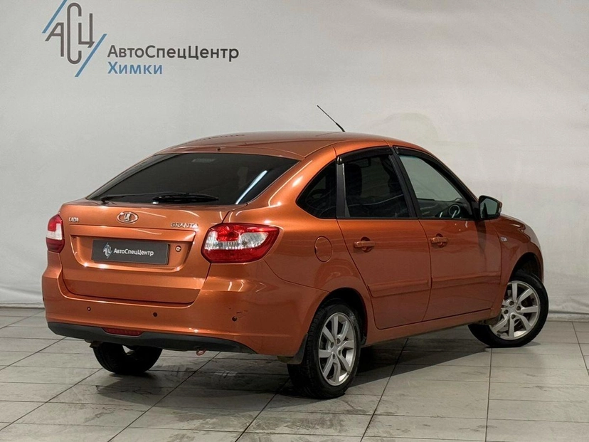 Автомобиль Lada (ВАЗ) Granta I поколение 1.6 MT (106 л.с.) Luxe Prestige 21917-52-008 Оранжевый 2015 с пробегом 92 000 км
