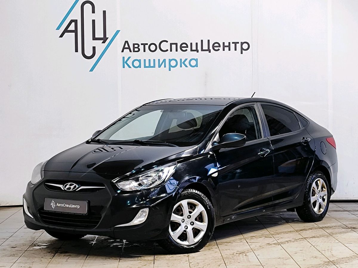 Автомобиль Hyundai Solaris I поколение 1.4 AT (107 л.с.) Comfort Чёрный 2012 с пробегом 119 707 км