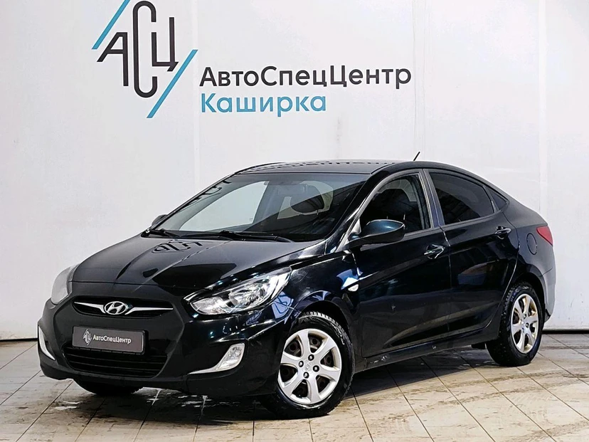 Автомобиль Hyundai Solaris I поколение 1.4 AT (107 л.с.) Comfort Чёрный 2012 с пробегом 119 707 км