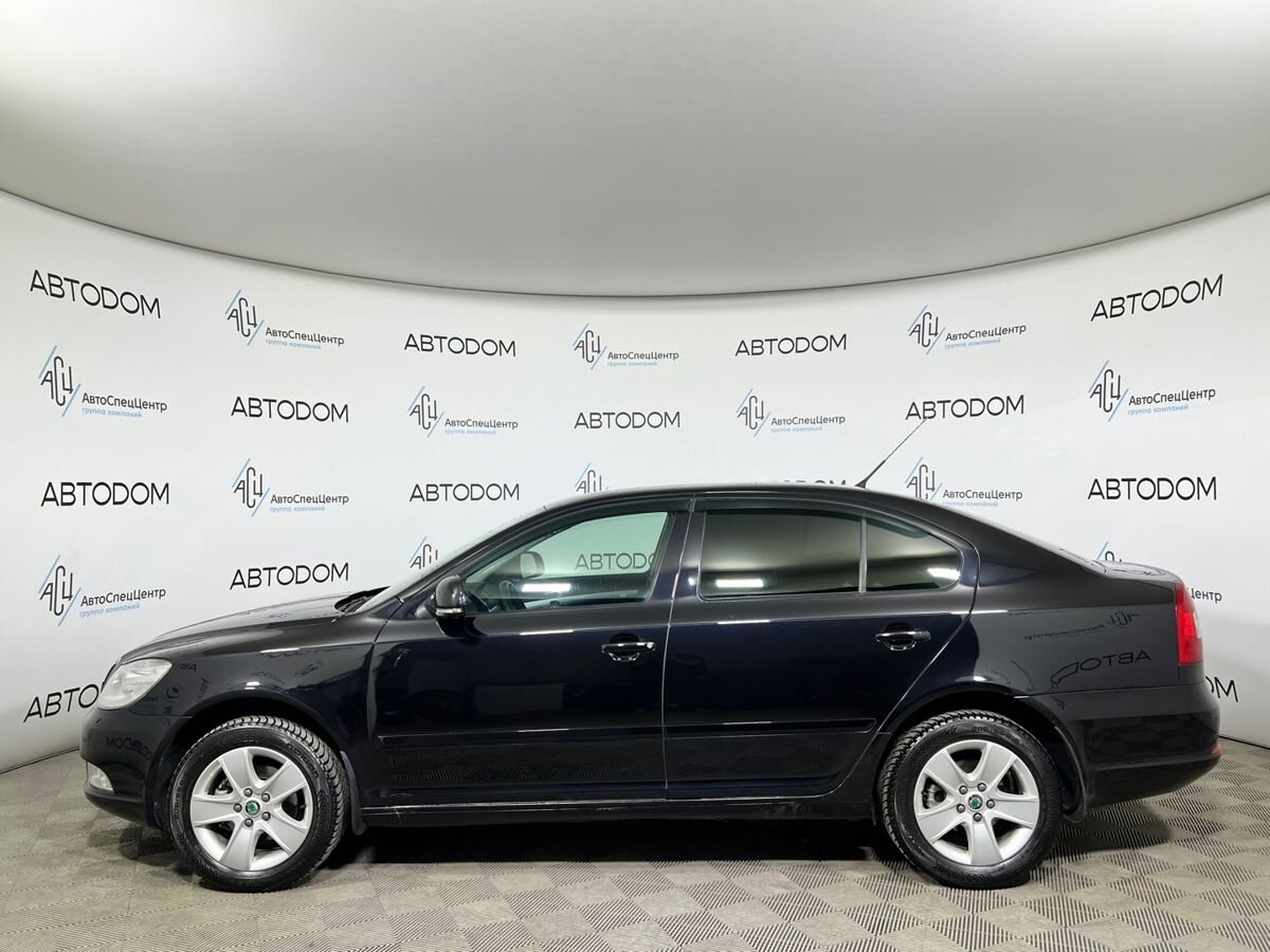 Автомобиль Skoda Octavia II (A5) [рестайлинг] 1.4 MT (122 л.с.) Ambition Чёрный 2012 с пробегом 166 221 км