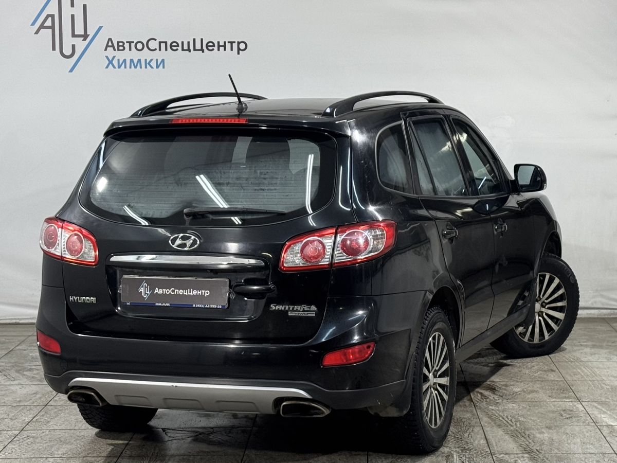 Автомобиль Hyundai Santa Fe II (CM) [рестайлинг] 2.4 AT 4WD (174 л.с.) Comfort Чёрный 2012 с пробегом 185 800 км