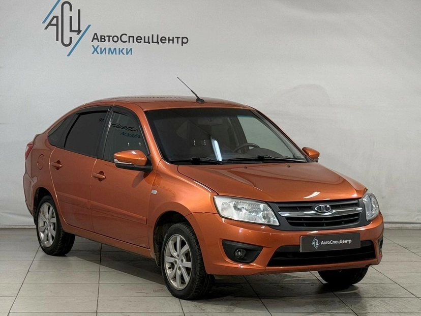 Автомобиль Lada (ВАЗ) Granta I поколение 1.6 MT (106 л.с.) Luxe Prestige 21917-52-008 Оранжевый 2015 с пробегом 92 000 км