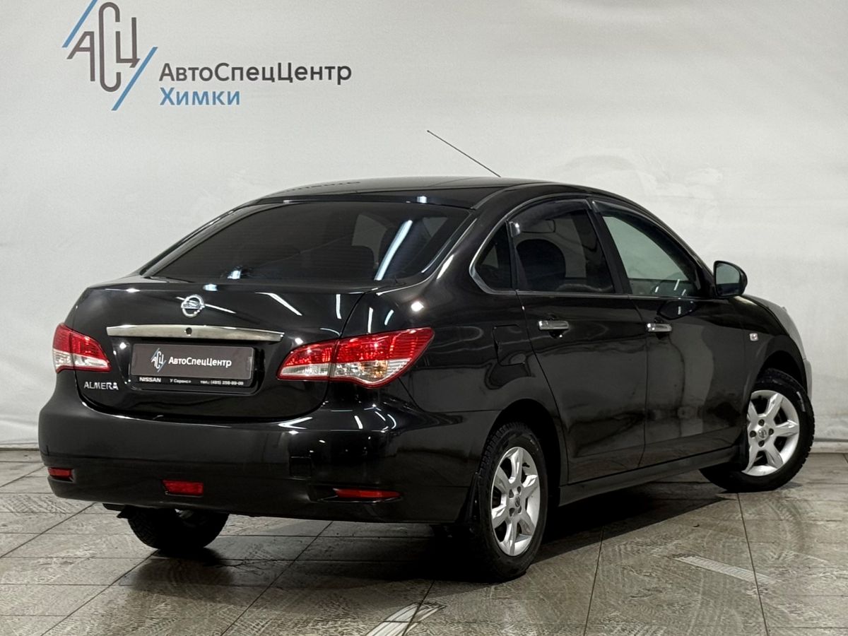 Автомобиль Nissan Almera III поколение (G15) 1.6 AT (102 л.с.) Comfort A/C Чёрный 2015 с пробегом 96 000 км