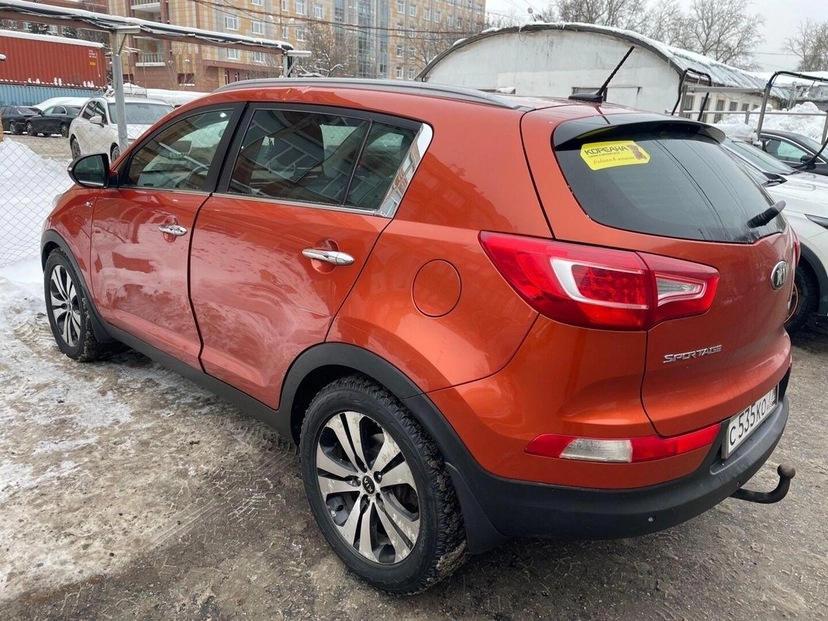 Автомобиль Kia Sportage III поколение 2.0 AT 4WD (150 л.с.) Premium Оранжевый 2013 с пробегом 120 312 км