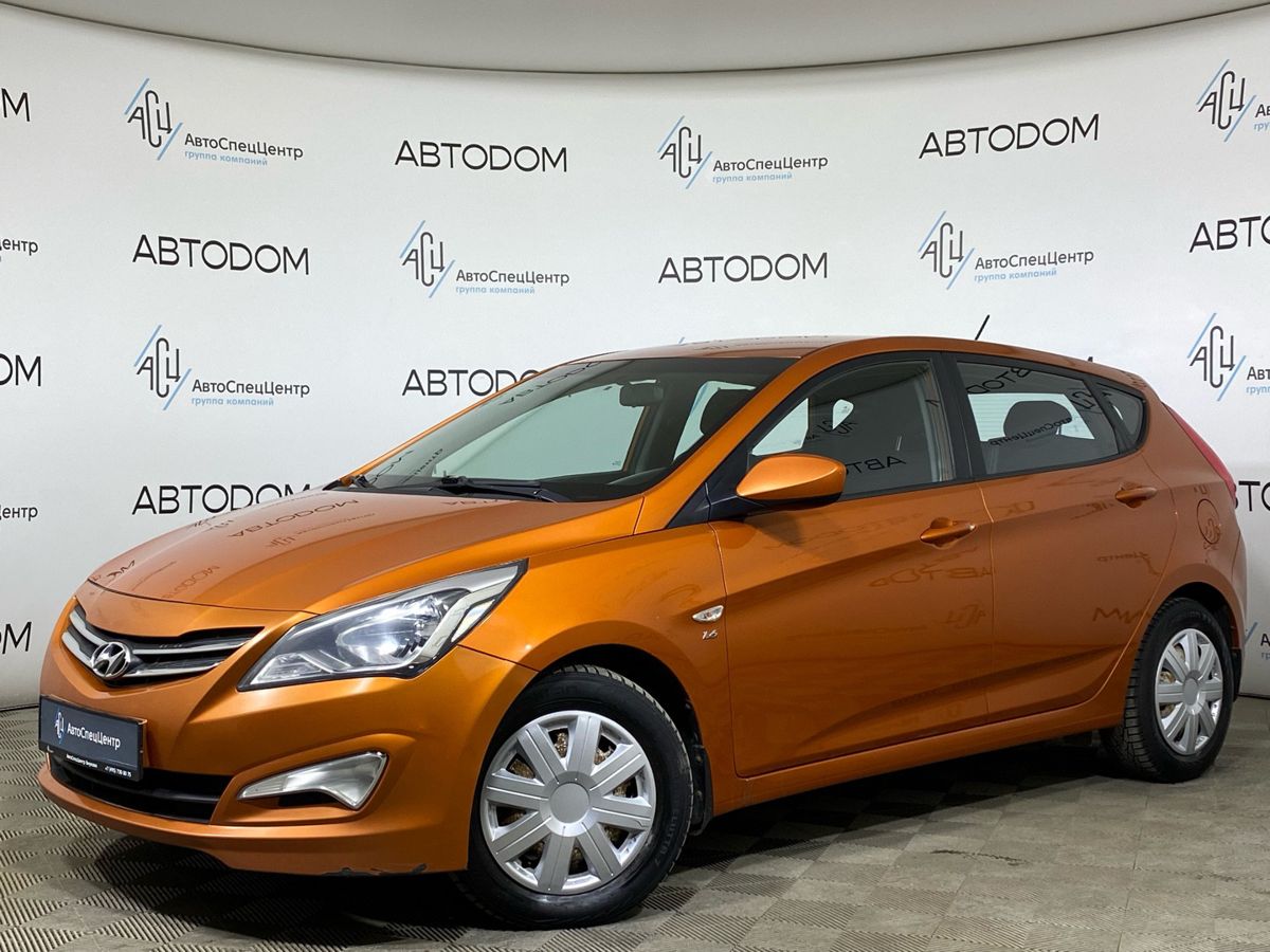 Автомобиль Hyundai Solaris I [рестайлинг] 1.6 AT (123 л.с.) Comfort Оранжевый 2015 с пробегом 139 453 км