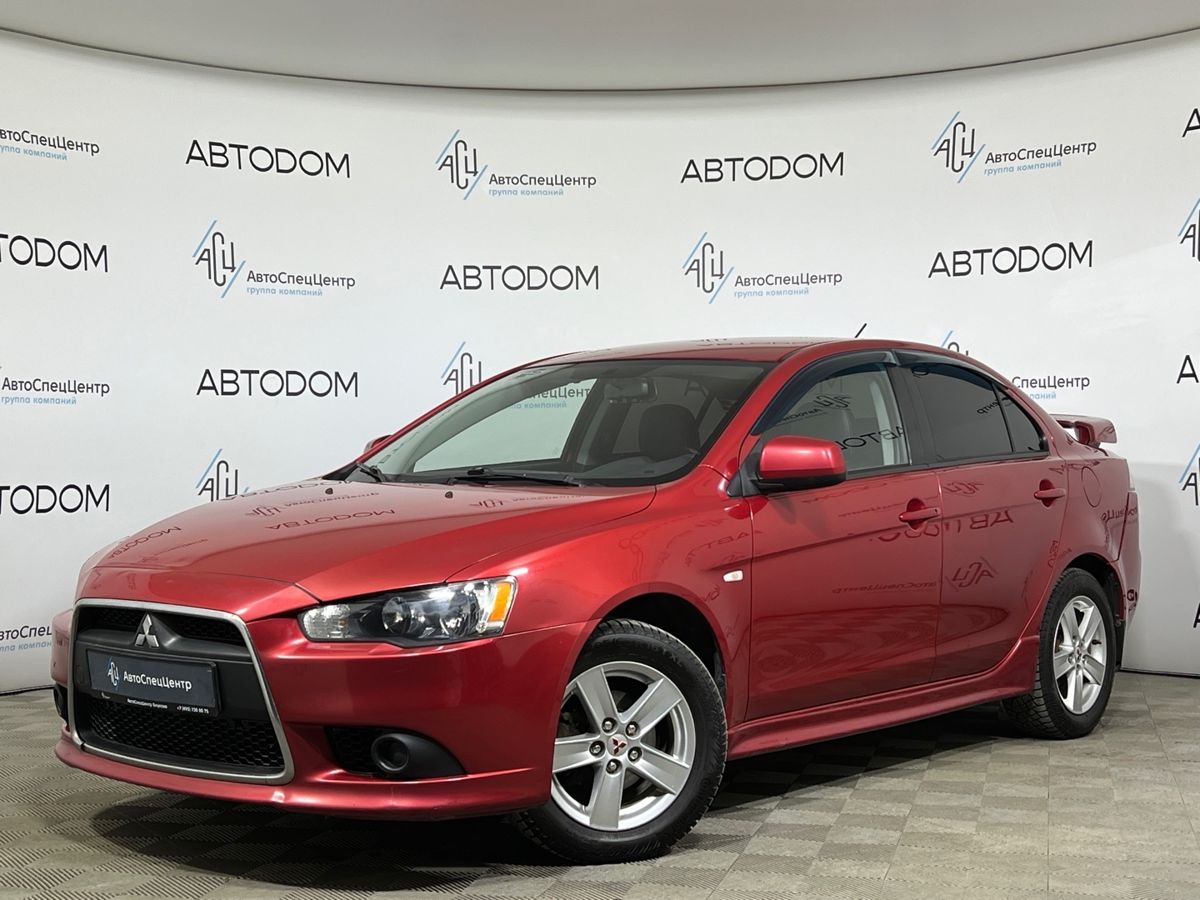 Автомобиль Mitsubishi Lancer X [1-й рестайлинг] 1.5 AT (109 л.с.) Invite Красный 2011 с пробегом 174 000 км