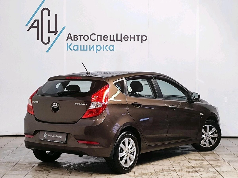 Автомобиль Hyundai Solaris I поколение 1.6 AT (123 л.с.) Classic Коричневый 2014 с пробегом 26 969 км